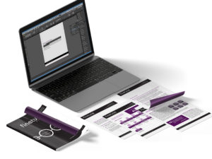 Open laptop surrounded by pieces of paper.